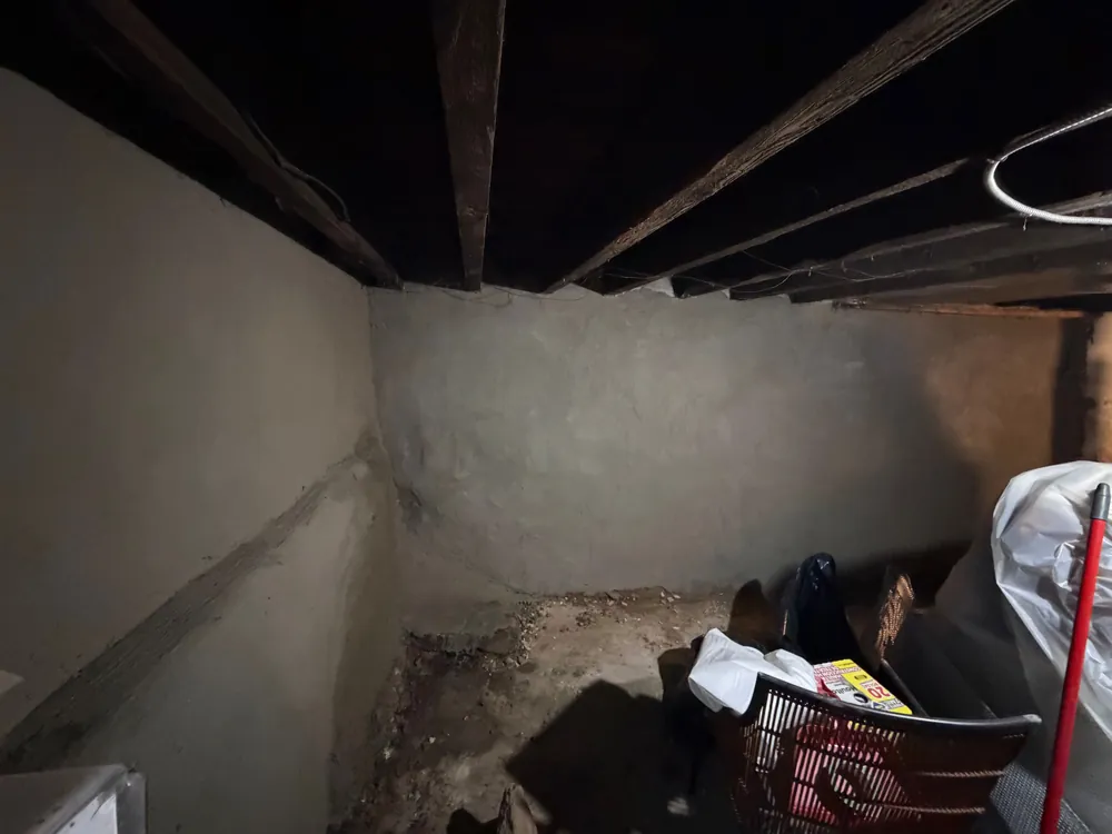 Basement walls after parging and sealing by PA Home Services: smooth, sealed foundation walls